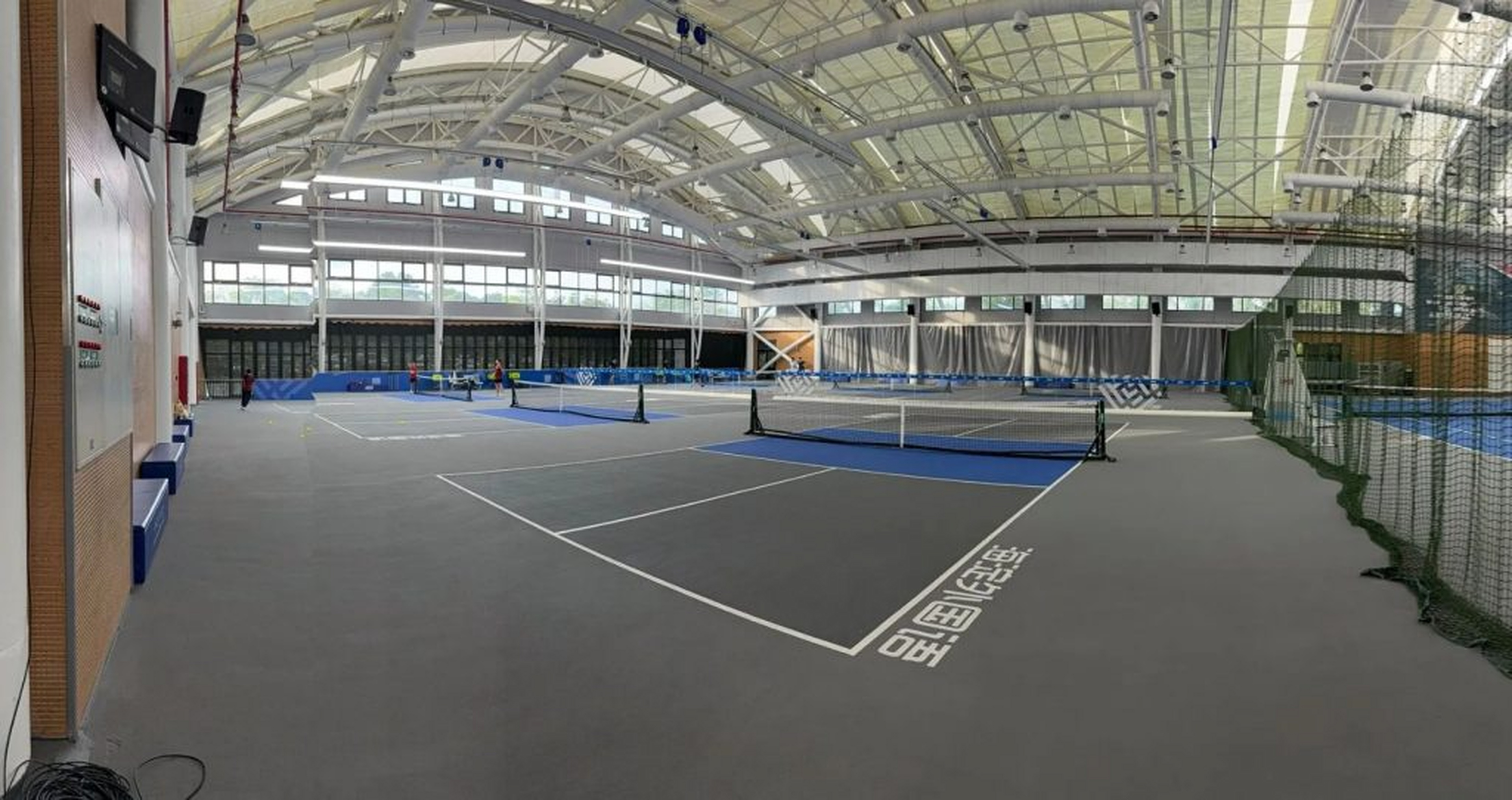 Pristine indoor courts sheltered from Hainan’s intense tropical humidity.