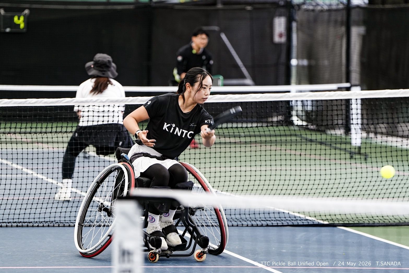 Shiori Funamizu competing at the net in wheelchair pickleball