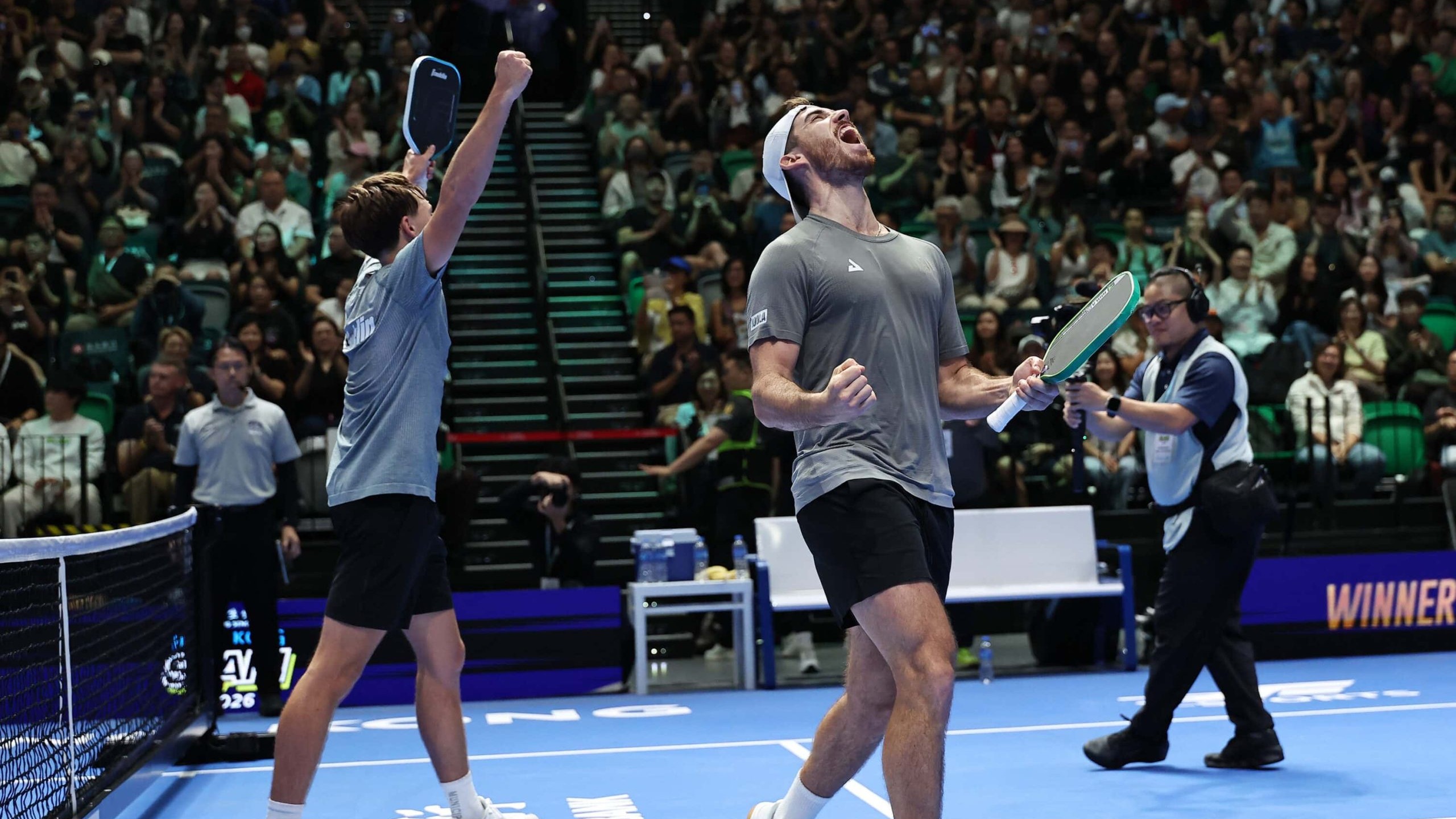 Hayden Patriquin and Federico Staksrud celebrate on court at Kai Tak Arena after beating Ben Johns and Gabriel Tardio in the Hong Kong Slam final